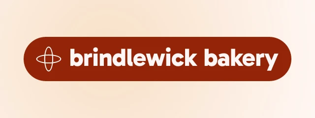 Brindlewick Bakery logo: Gabarito 800, badge layout, orbit symbol, rust and gold