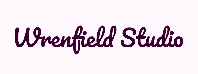 Wrenfield Studio logo: Pacifico 400, wordmark layout, none symbol, plum and olive